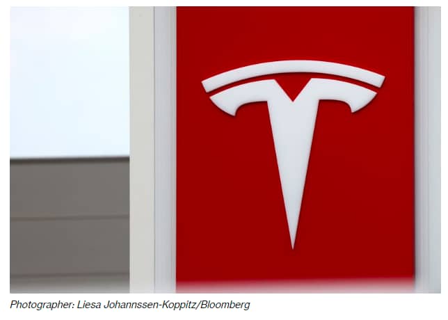 Tesla Logo background Bloomberg LJK