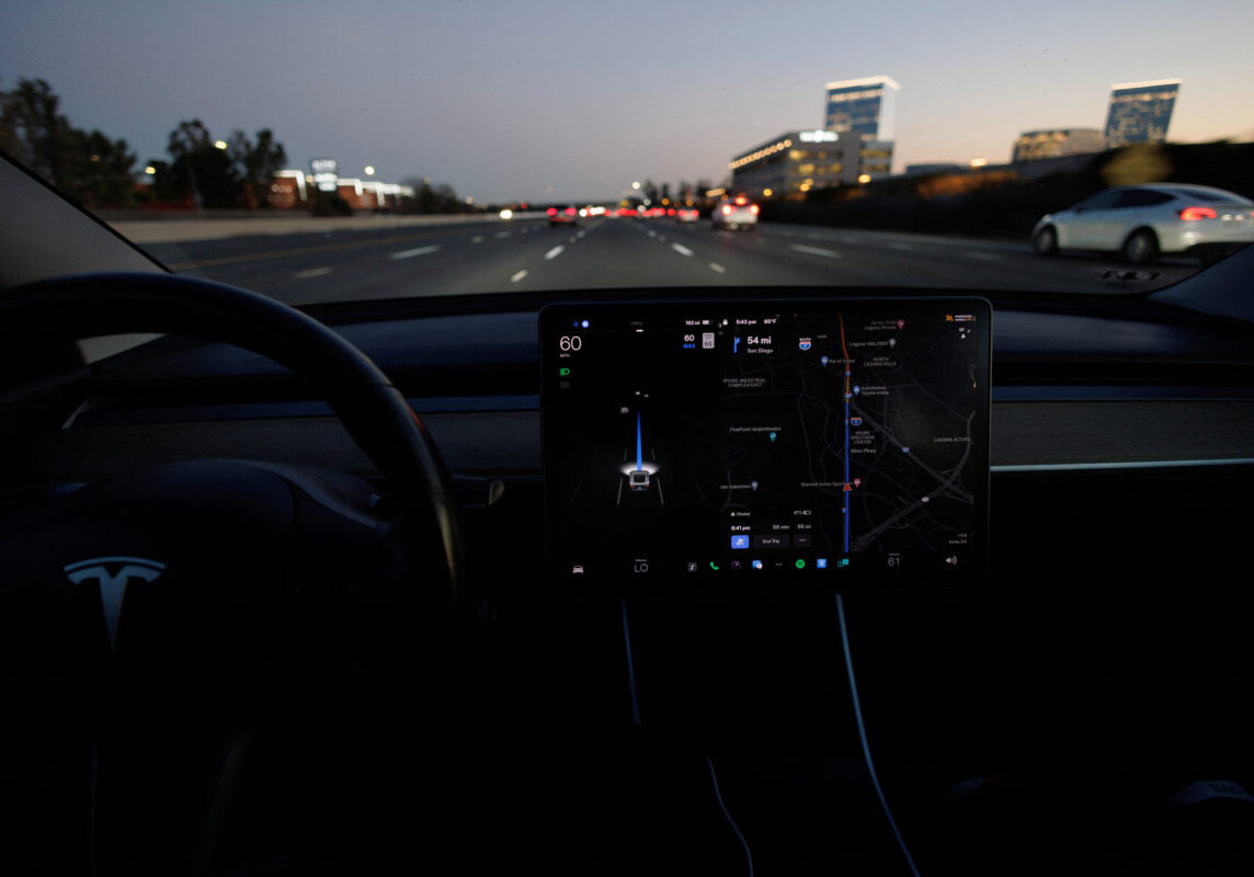 A Tesla Model 3 vehicle is shown driving using Full Self Driving (FSD) beta software on a California highway near Irvine, California, U.S., February 7, 2023. REUTERS/Mike Blake