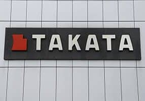 FILE- This June 25, 2017, file photo shows TK Holdings Inc. headquarters in Auburn Hills, Mich. Japanese air bag maker Takata Corp. has reached a $650 million deal to settle consumer protection claims from 44 states and Washington, D.C., but only a fraction of the money will be paid due to Takata's financial problems and bankruptcy. In an agreement announced Thursday, Feb. 22, 2018, the states said they will not collect the settlement so that victims of Takata's faulty air bag inflators can get a bigger piece of the company's remaining money. (AP Photo/Paul Sancya, File)